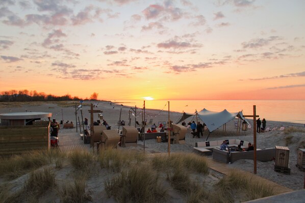 On the beach, sun loungers