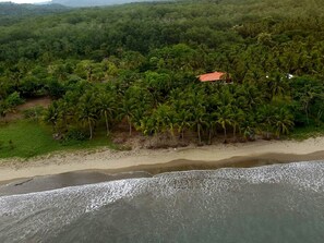 On the beach, sun-loungers