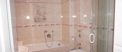 Bathtub, hair dryer, towels, soap