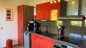Fridge, stovetop, dishwasher, coffee/tea maker