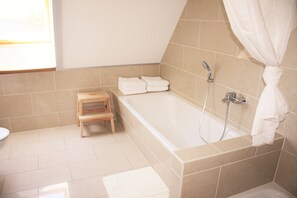 Combined shower/tub, hair dryer, towels, soap