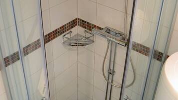 Shower, hair dryer, soap, toilet paper