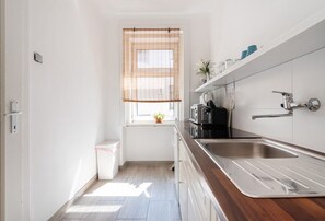 Fridge, microwave, stovetop, coffee/tea maker