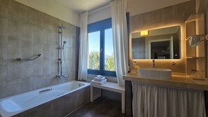 Combined shower/bathtub, hair dryer, towels, soap