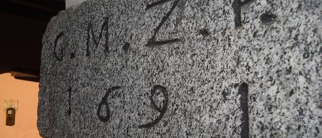 A stone plaque with inscriptions.