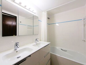 Combined shower/tub, hair dryer, towels, soap