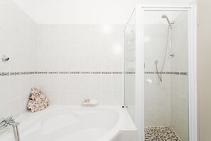 Bathtub, hair dryer, towels, soap