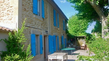 Enjoy outdoor dining or relaxation on the patio with a table and chairs.