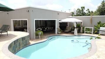 Outdoor pool, pool umbrellas, sun loungers