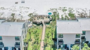 A beachfront hotel with multiple buildings, a sandy beach, and a clear view of the ocean. - Beautiful gated community,  (Panama City)