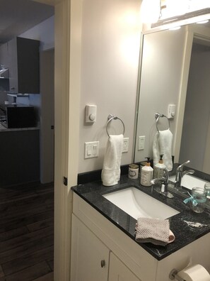 Combined shower/tub, hair dryer, towels, soap