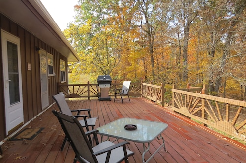 A nice view of the woods awaits you from the countryside kitchen window and deck