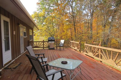 A nice view of the woods awaits you from the countryside kitchen window and deck