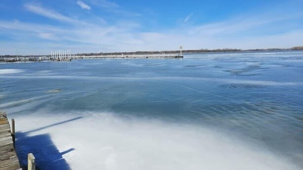 A frozen body of water with a wooden dock extending into it. - 2 Bedroom Cottage 100 yards to water. Dock & Ramp. (Lakeside Marblehead)