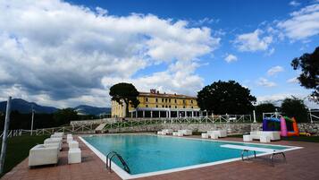 Seasonal outdoor pool, pool umbrellas, pool loungers