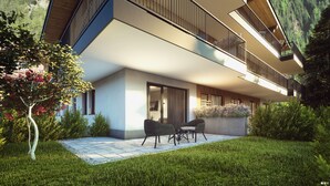 Un bâtiment moderne à deux étages, doté d’un toit plat, de grandes fenêtres et d’un balcon avec des garde-corps en métal.