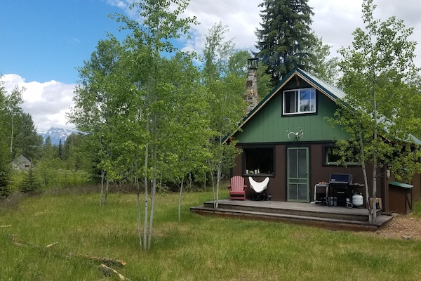Lovely front porch for grilling and relaxing in the western exposure...