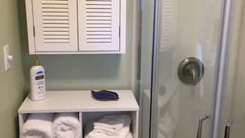 Shower, hair dryer, towels, soap