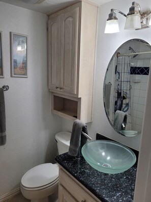 Shower, hair dryer, towels, toilet paper