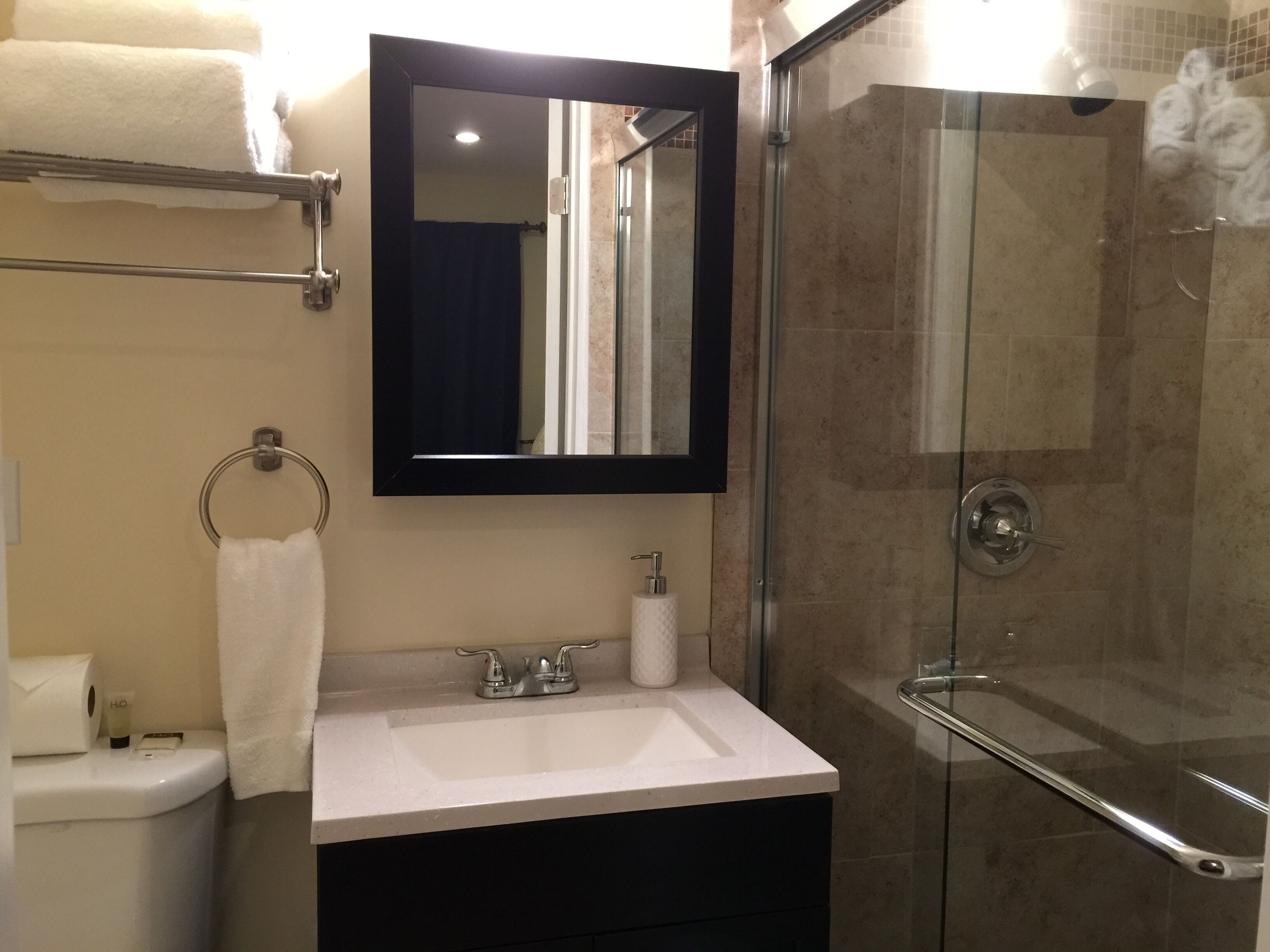 Shower, hair dryer, towels, soap