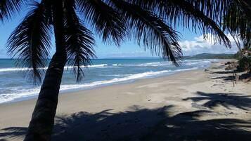 On the beach, sun loungers, beach towels