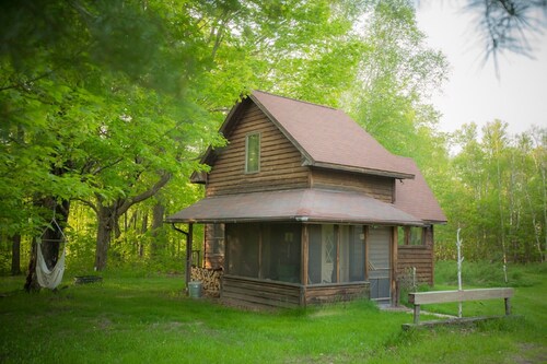 Spiral Staircase Leads To The Lofted Bedroom And Overlooks The Birch Woods.