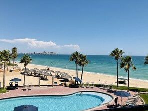 On the beach, sun loungers, beach towels