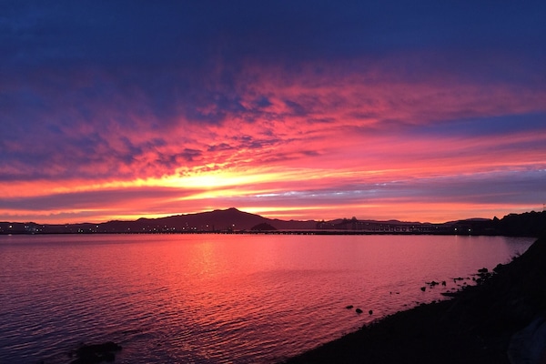 Sunset from your own deck - view all three bridges and the pelicans fishing!