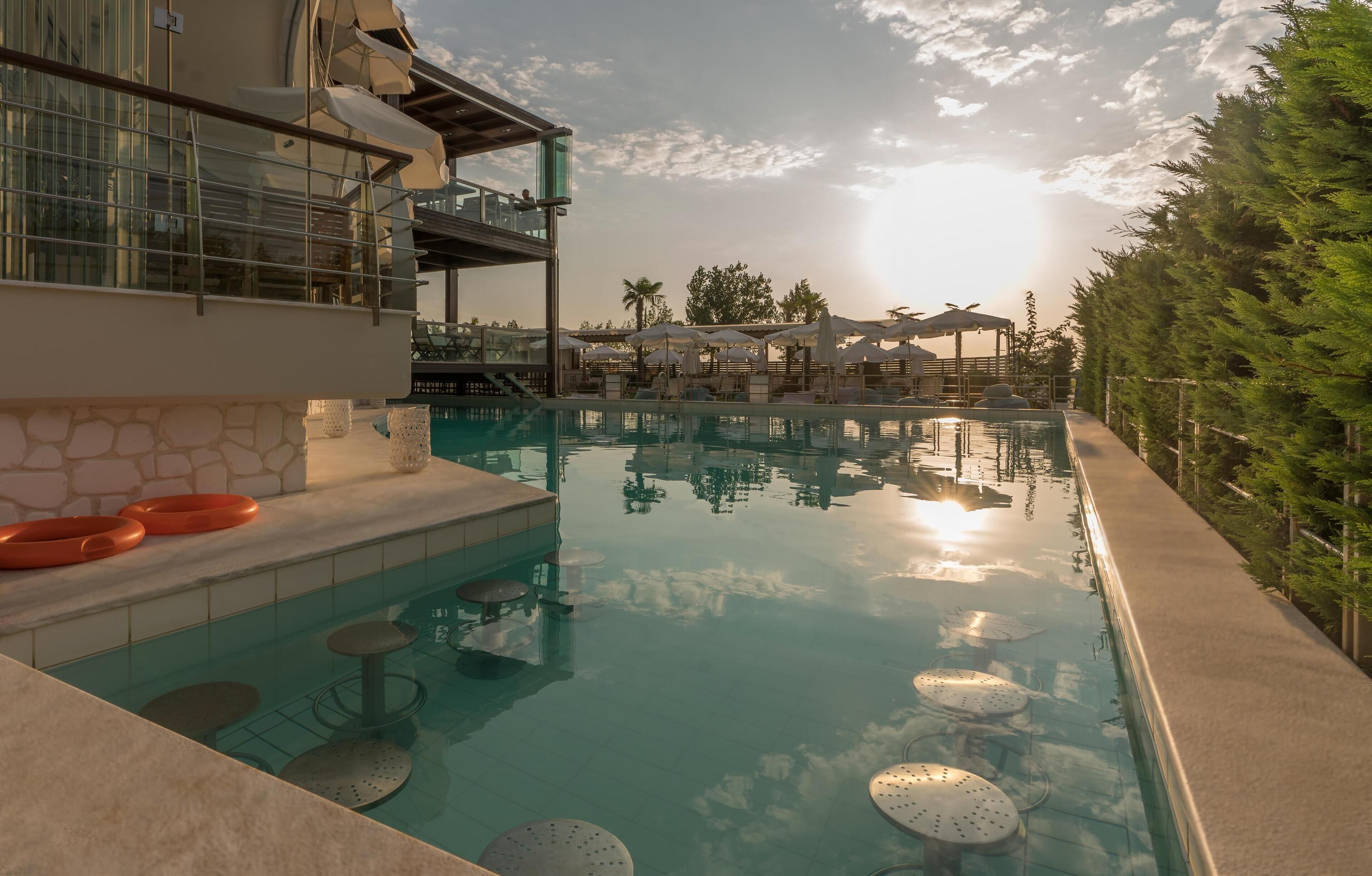 Seasonal outdoor pool, pool umbrellas, sun loungers