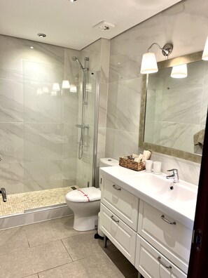 Shower, hair dryer, towels, soap