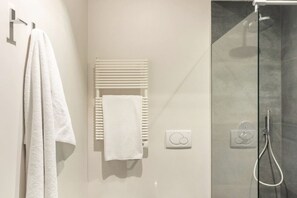Bathtub, eco-friendly toiletries, hair dryer, bidet