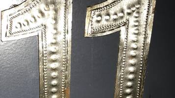 Two metallic numbers '1' with embossed details, likely part of a larger structure or decoration.