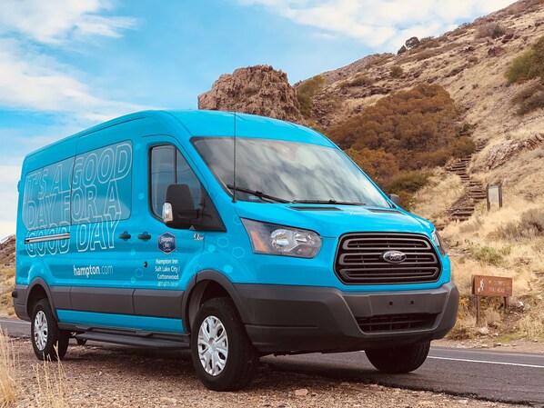 A blue van with "It's a good day for a good day" and Hampton Inn Salt Lake City Cottonwood branding. - Hampton Inn Salt Lake City Cottonwood UT (Salt Lake City)