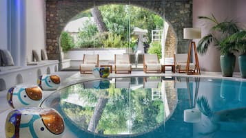 Indoor pool, outdoor pool, open 10:00 AM to 7:00 PM, pool umbrellas