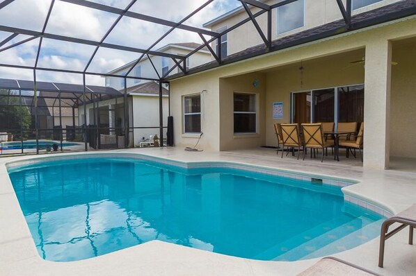 A heated pool, pool loungers
