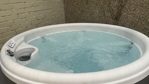 A hot tub with a control panel and a label on the side. - Awelon sleeps 10, Hot Tub, Log Burner, private courtyard, Porthmadog, Snowdonia (porthmadog)