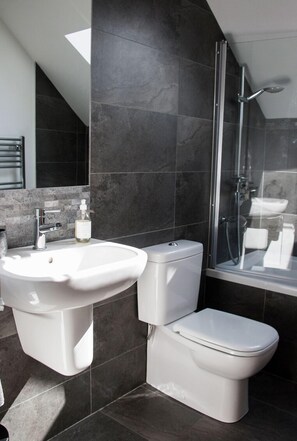 Combined shower/tub, hair dryer, towels, soap
