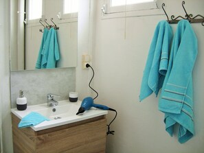 Shower, hair dryer, towels, toilet paper