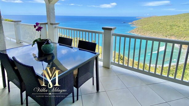 A glass table with chairs on a balcony overlooking a coastal view. - Newly Updated! Private Beach Views, Luxury Villa Milagro Villa 1 (St.Thomas U.S.V.I)