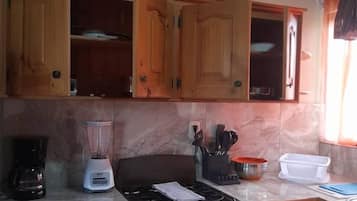Fridge, microwave, stovetop, coffee/tea maker