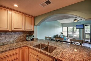 Enjoy meals in the kitchen with a double sink and dining area.