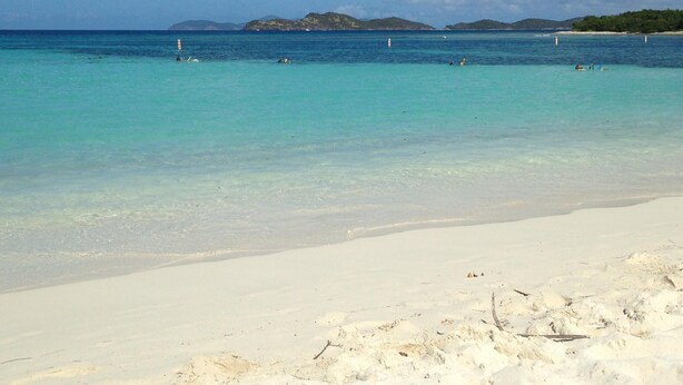 A beach with clear turquoise water, white sand, and distant mountains under a blue sky with clouds. - Paradise Found/Breathtaking Views/ Dedicated Wi-Fi
MONTHLY SPECIAL  6/15 - 11/15 (St Thomas)