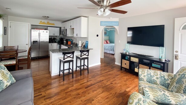 A modern living space with a kitchen, dining area, and a bedroom. - Wampler's Lake in Brooklyn, MI close to MIS with access to dock (Brooklyn)