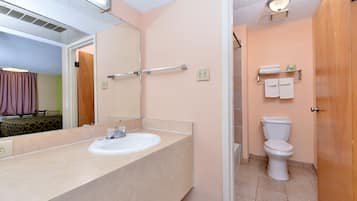 Standard Room, 1 King Bed | Bathroom | Combined shower/bathtub, rainfall showerhead, free toiletries, towels