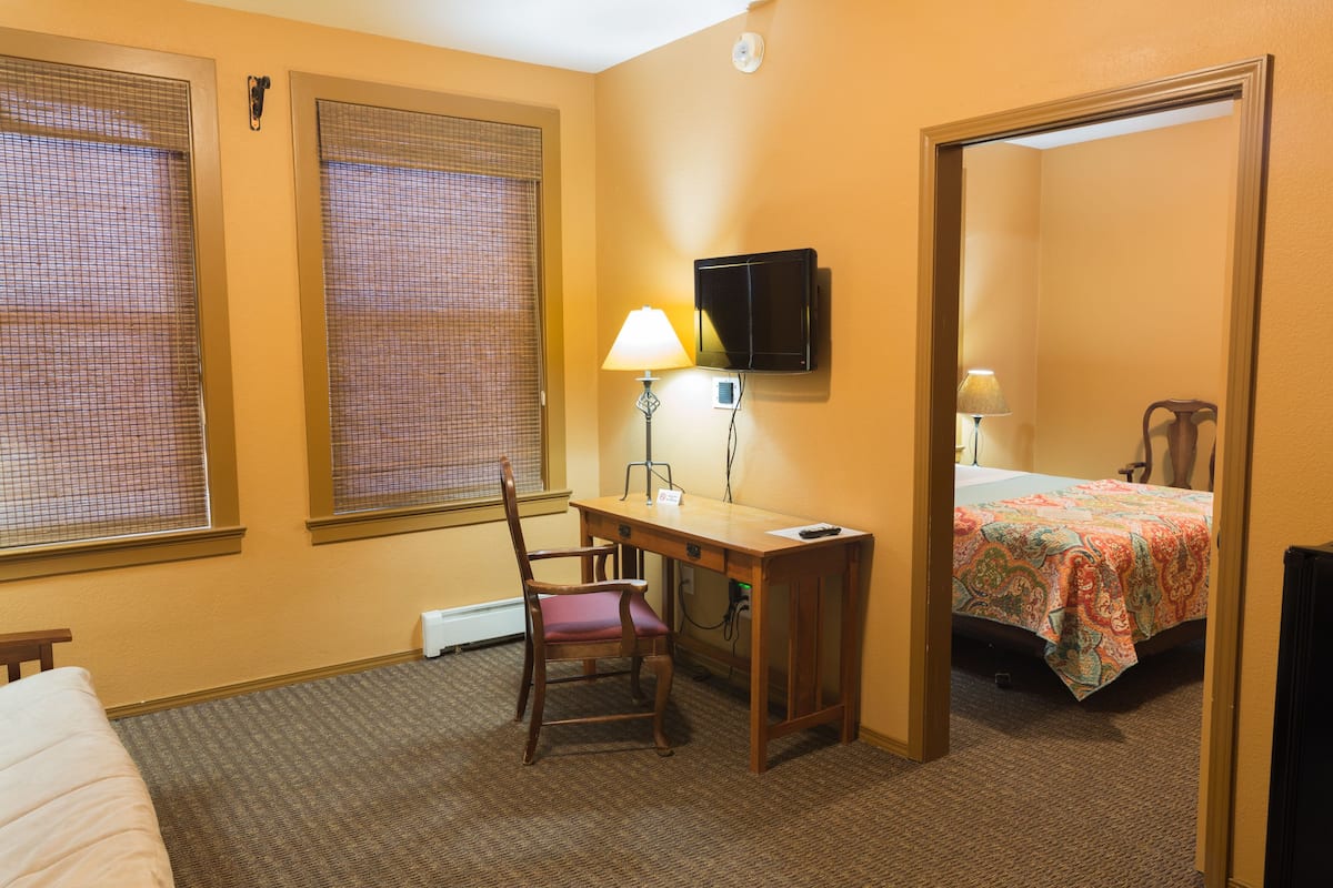 basic suite, 1 bedroom, refrigerator, river view | living room | flat-screen tv