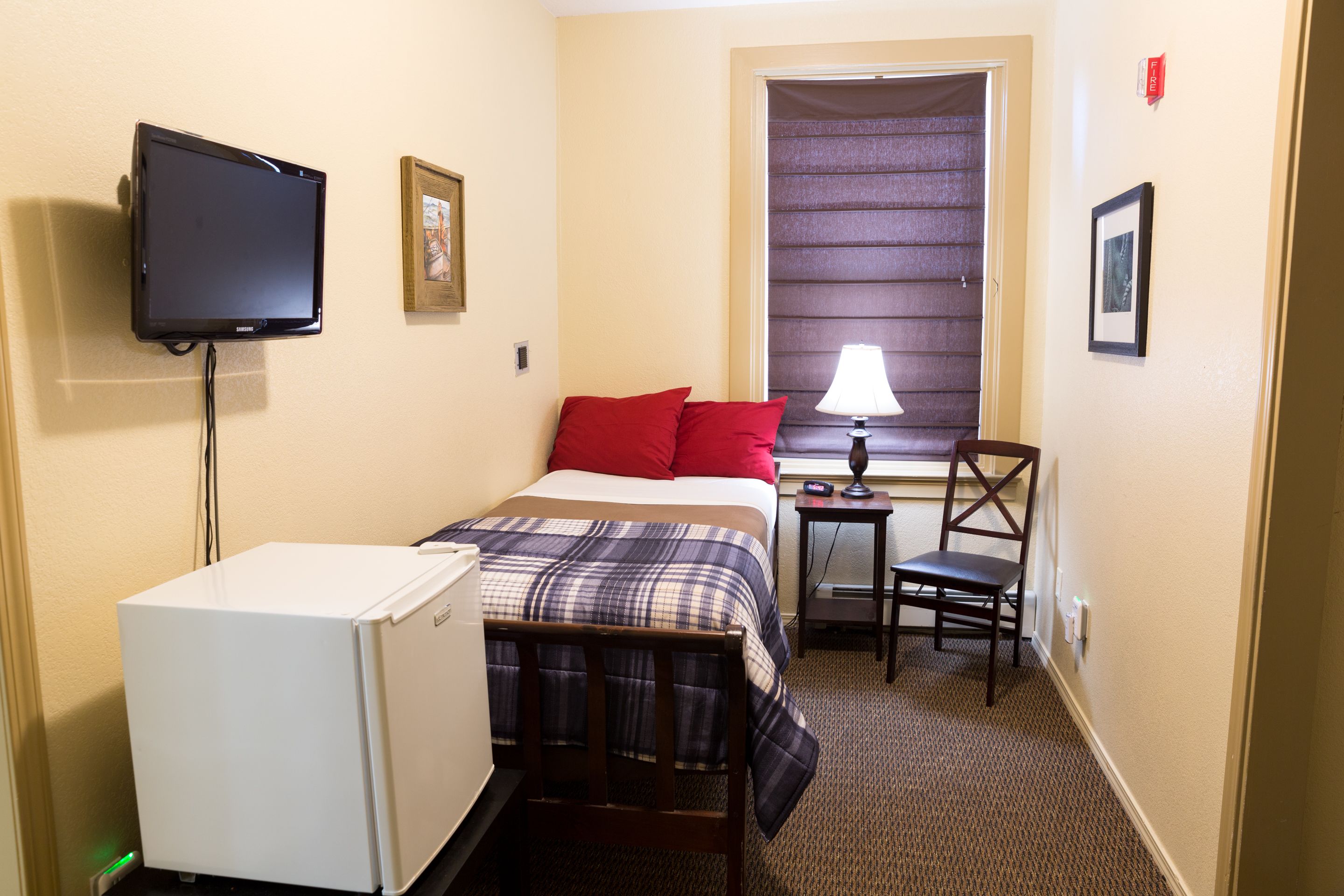 economy room, 1 single bed, refrigerator, city view | iron/ironing board, free wifi, bed sheets, wheelchair access