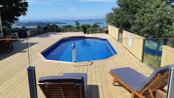 Outdoor pool, pool umbrellas, pool loungers