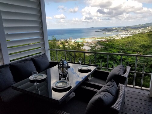 MILLION DOLLAR VIEW SET ATOP ONE ACRE OF CARIBBEAN SPLENDOR