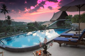 A swimming pool with a tiled edge, lounge chairs, and a decorative plant. - Enjoy this fabulous Luxury 4 bed villa with personal chef, staff and pool (Kata)