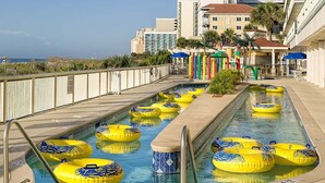 A swimming pool with multiple yellow inflatable rings and a tiled edge. -  Special Exceptional Offer Guaranteed Oceanfront Villa  Available July 11-18 (Myrtle Beach)